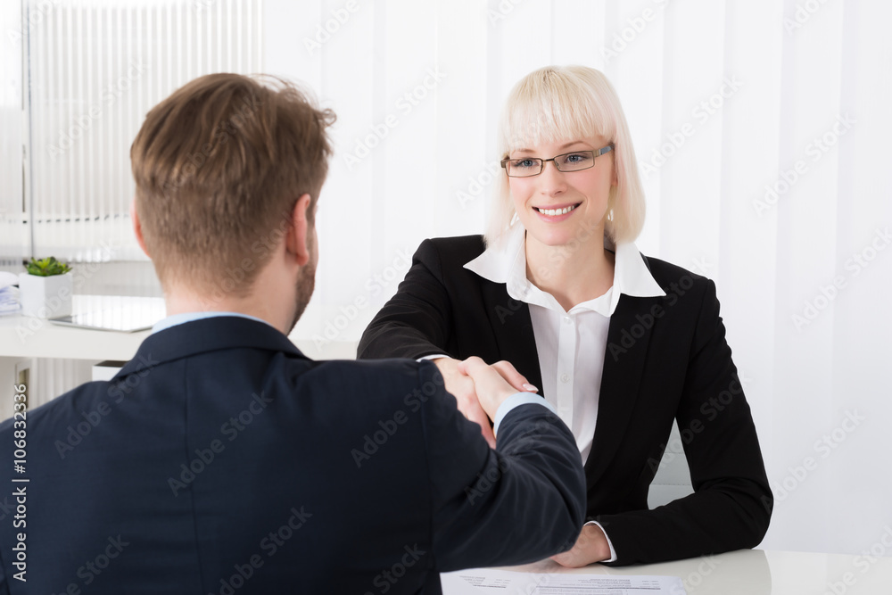 Businesswoman Shaking Hands With Businessman