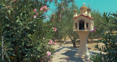 Traditional Greek memorial chapel kandylakia on the roadside. photo