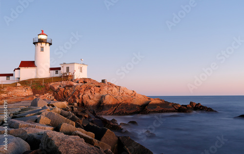 Eastern Point Lighthouse at Gloucester at Sunset, Massachusetts, USA. One of the five iconic lighthouses have been built along the Cape Ann coastline to protect seafarers from rocky shores and shoals.