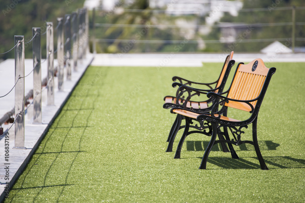 wooden chairs on the green grass wooden chairs on the green grass