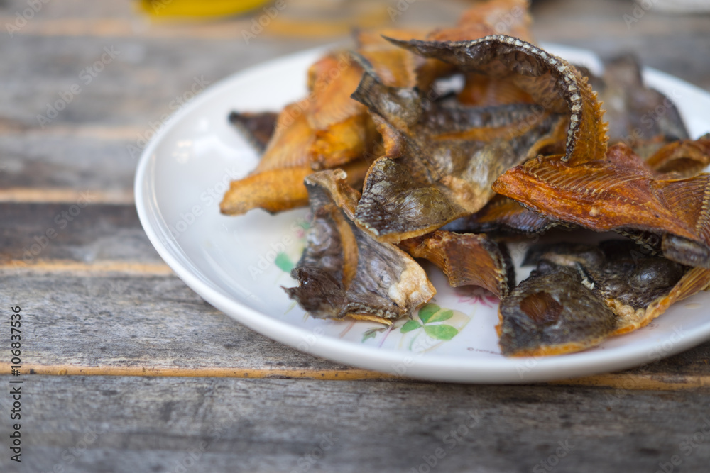 Fish tilapia fried delicious thai food on wood table