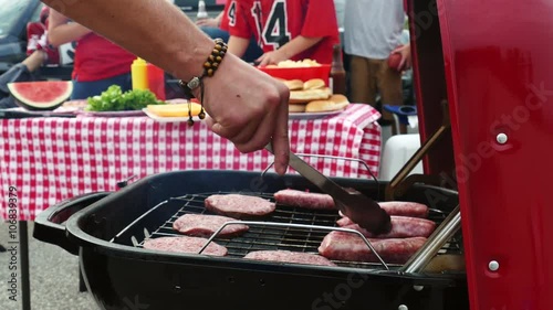 Tailgate: Man Cooking Meat On Grill For Party