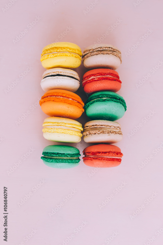 Colorful france macarons on pink background