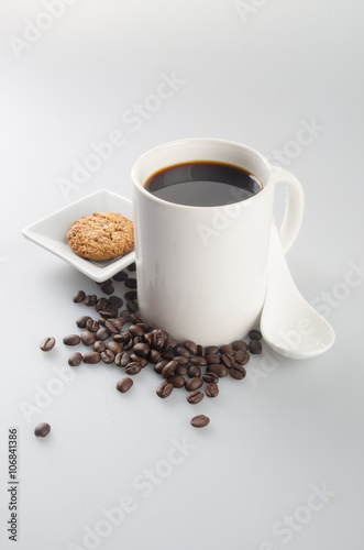 coffee or coffee and chocolate cookie on background.
