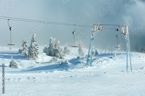 Ski lift on winter hill.