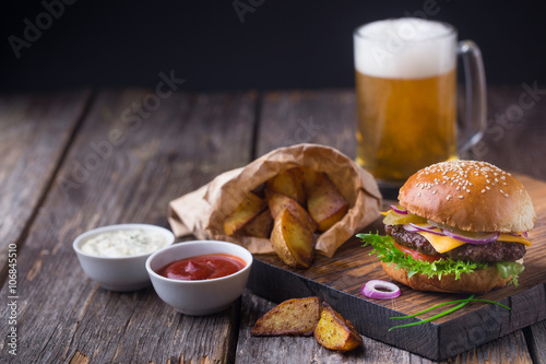 Burger with cold beer and fries