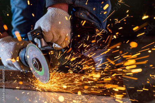 Worker working of a grinding machine