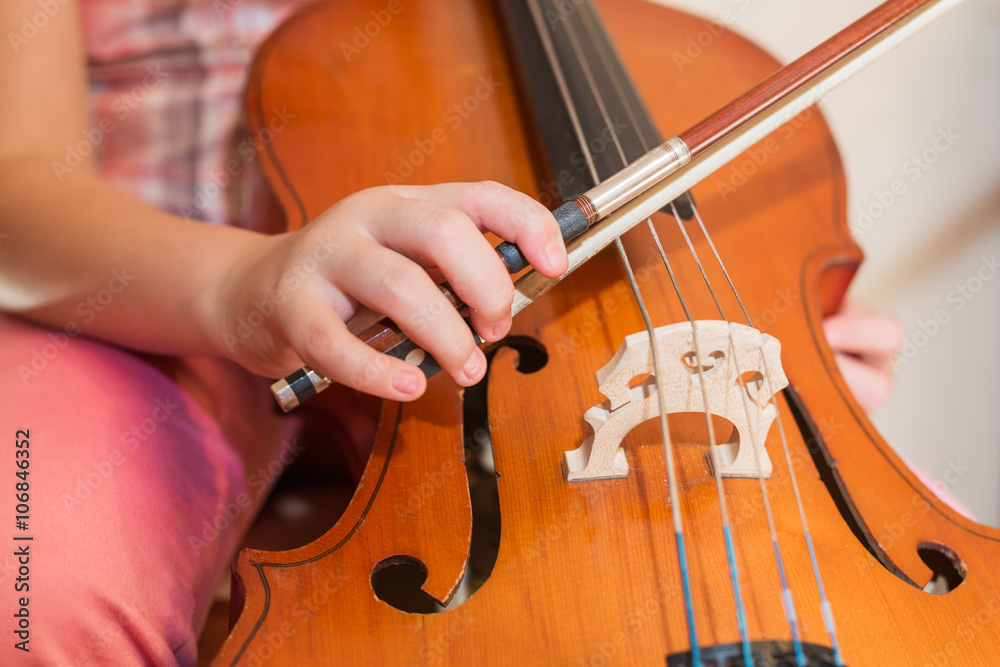 Cello instrument close up view, young musician playing Cello instrument close up view, young musician playing