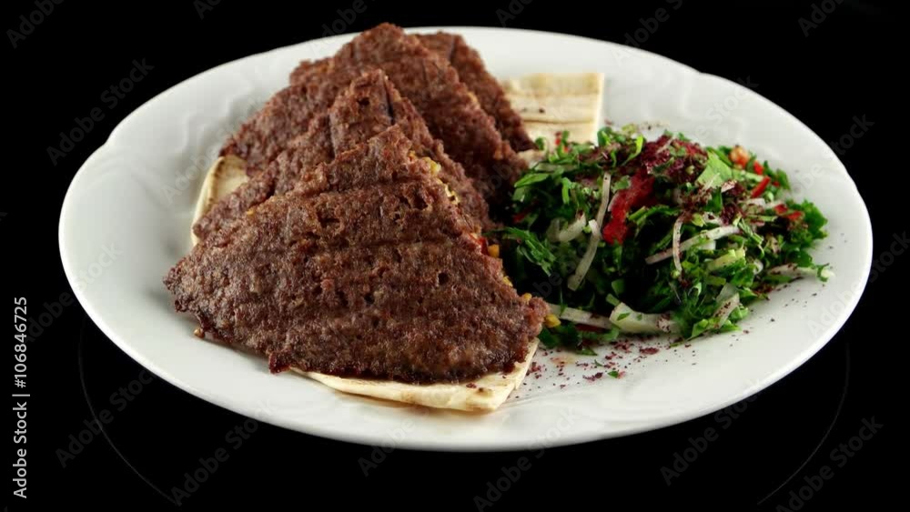 Grilled meat cutlets stuffed with cheese, pistachios on the pita bread, loop Grilled meat cutlets stuffed with cheese, pistachios on the pita bread, loop