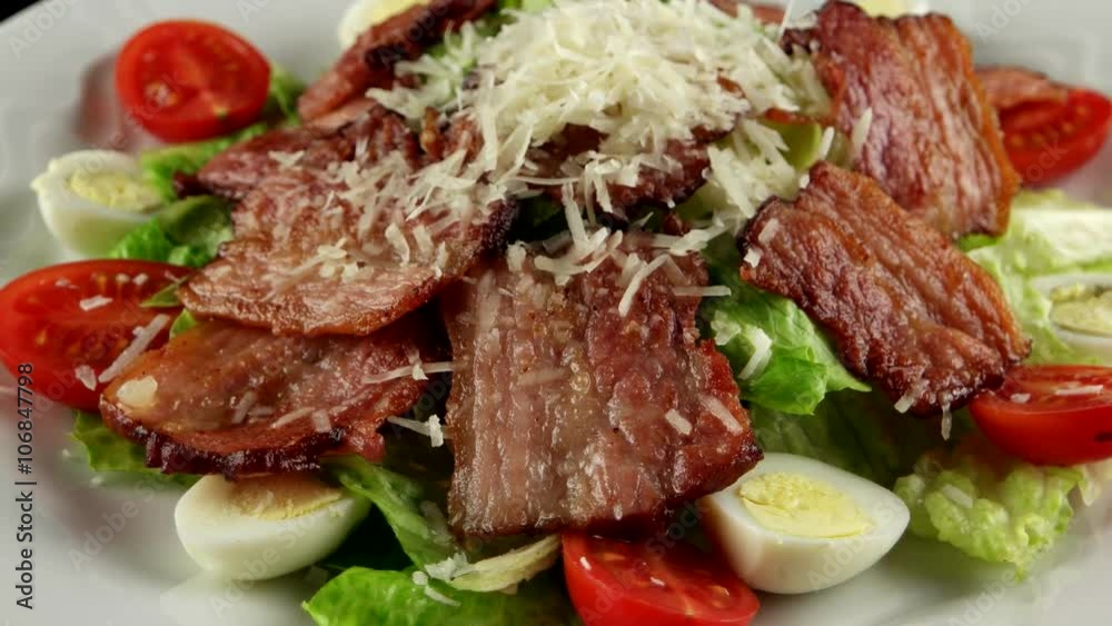 Salad with bacon, and Parmesan cheese, loop
Salad with bacon, and Parmesan cheese, loop