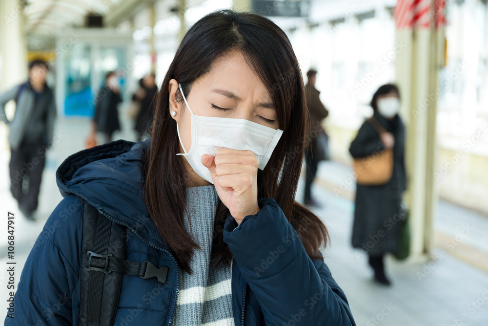 Woman feeling unwell in trains station Woman feeling unwell in trains station