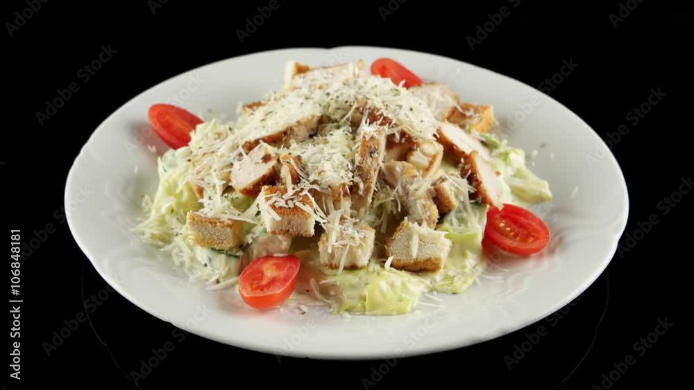 Caesar salad with grilled chicken, parmesan cheese, roasted rusks and tomatoes, loop