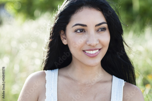 Hispanic woman smiling outdoors