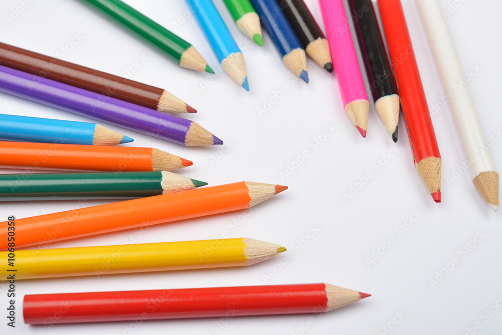 Close up picture of many little colored pencil crayons on white Close up picture of many little colored pencil crayons on white