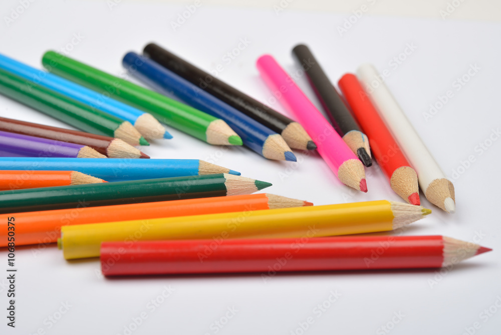 Close up picture of many little colored pencil crayons on white Close up picture of many little colored pencil crayons on white
