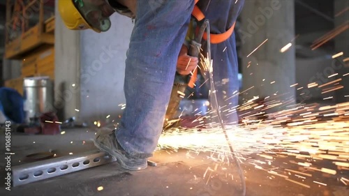 Electric wheel grinding on steel structure in construction site