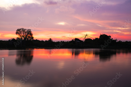 Silhouette of forest near the river.