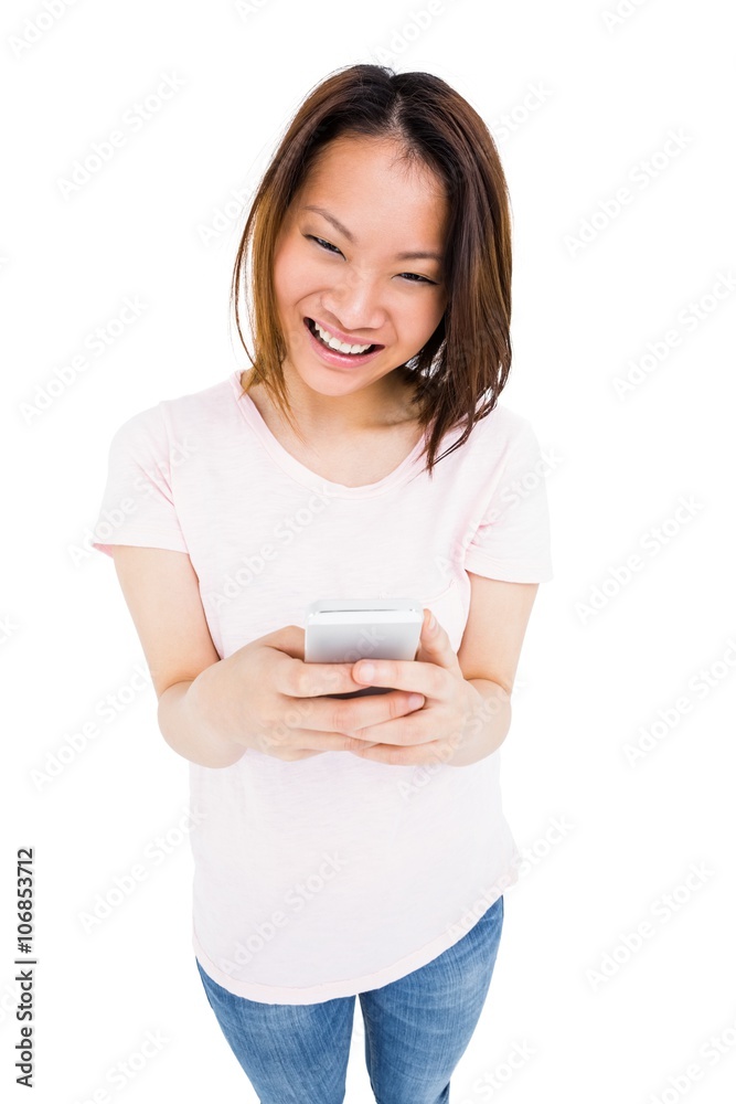 Young woman text messaging on mobile phone Young woman text messaging on mobile phone