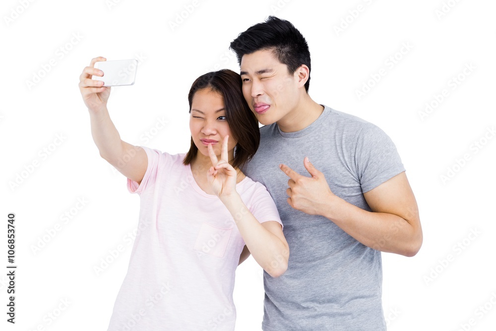 Young couple taking a selfie on smartphone Young couple taking a selfie on smartphone