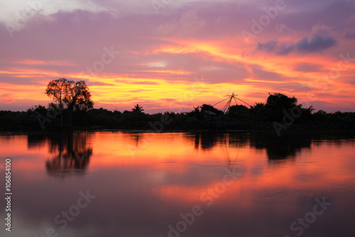 Silhouette of forest near the river.