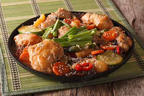 Korean cuisine Dakjim: chicken with vegetables and sesame close-up
 photo