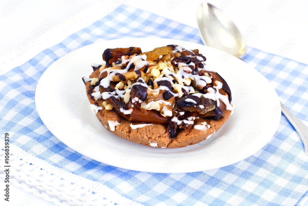 Homemade Cakes: Cake on Plate with Nuts, Chocolate and Raisins Homemade Cakes: Cake on Plate with Nuts, Chocolate and Raisins