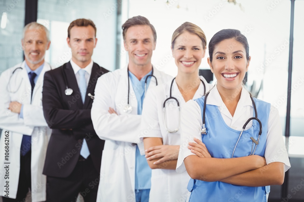 Happy medical team standing with arms crossed Happy medical team standing with arms crossed