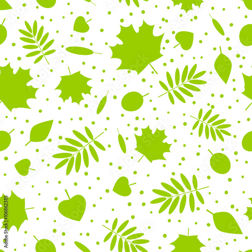 Seamless pattern with green leaves silhouettes 