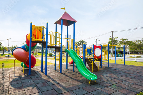 Fotografi Colorful playground on yard in the park.