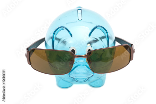 Glass piggy bank with sunglasses