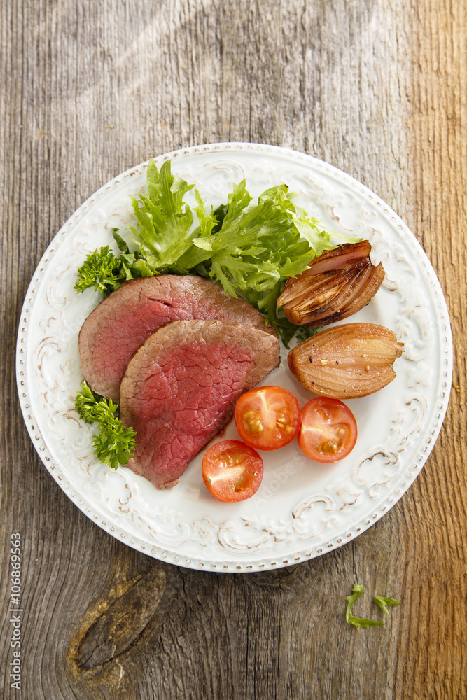 Roast beef with green salad and vegetables Roast beef with green salad and vegetables