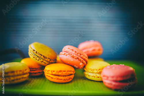 Macaroons - colored almond cookies with different flavors, French delights (filtered)
 photo