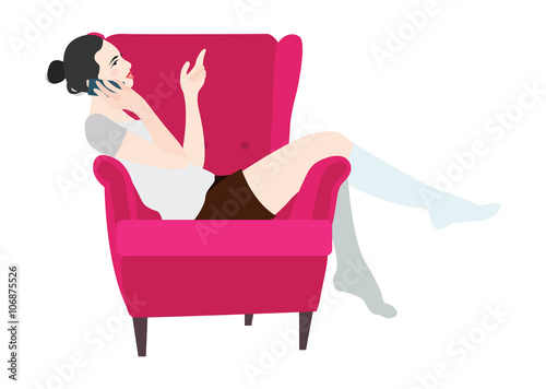 Woman sitting in a chair talking on the phone