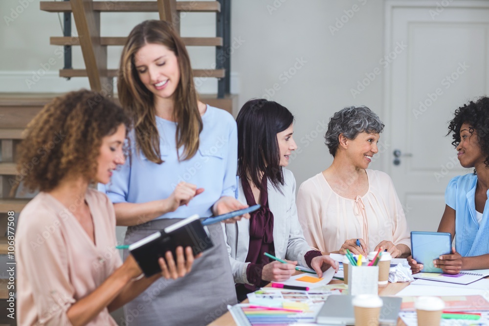Fototapeta premium Group of interior designers interacting with each other