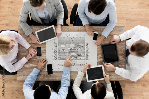 business team or architects with blueprint