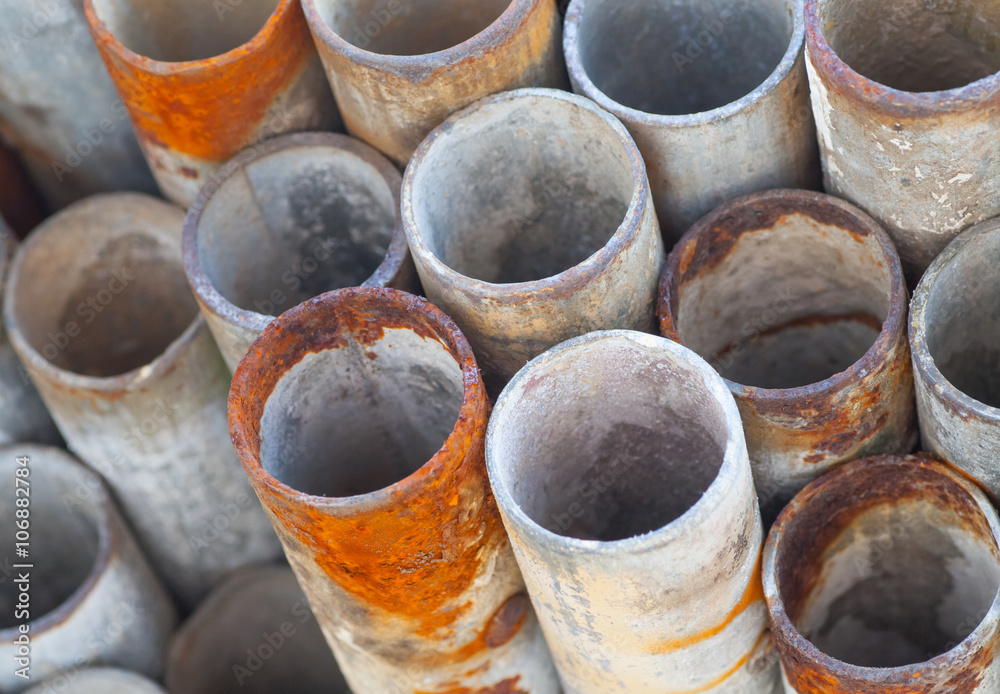 Close - up Stack of construction metal pipes . Close - up Stack of construction metal pipes .