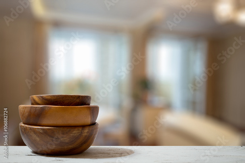 stack of empty wooden bowls on table