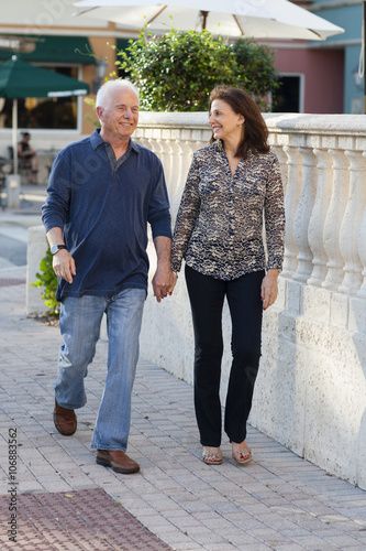 Wallpaper Mural Older Caucasian couple holding hands on sidewalk Torontodigital.ca