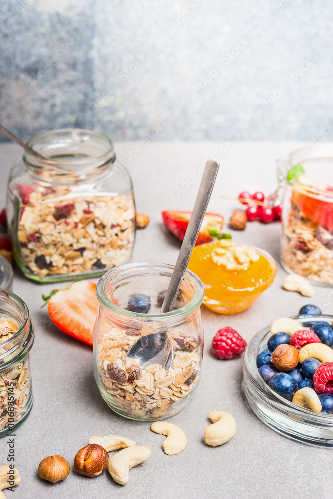 Breakfast in jar, preparation with fresh berries,nuts and muesli. Healthy and Clean food concept. Breakfast in jar, preparation with fresh berries,nuts and muesli. Healthy and Clean food concept.