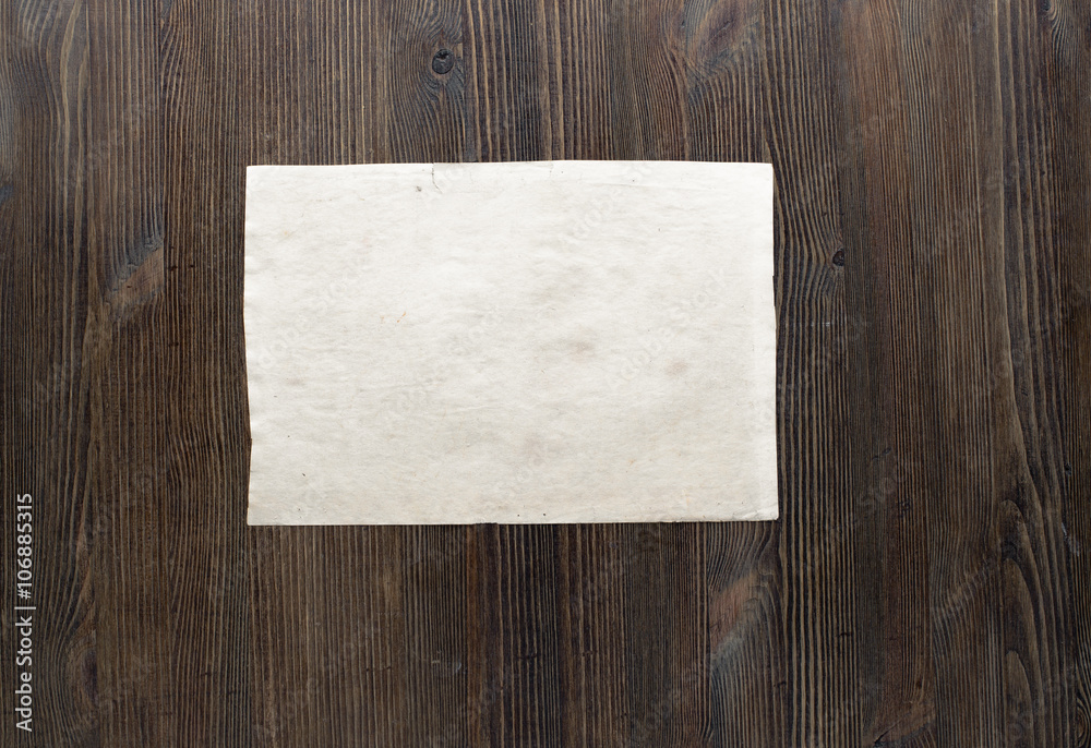 paper on wooden background paper on wooden background