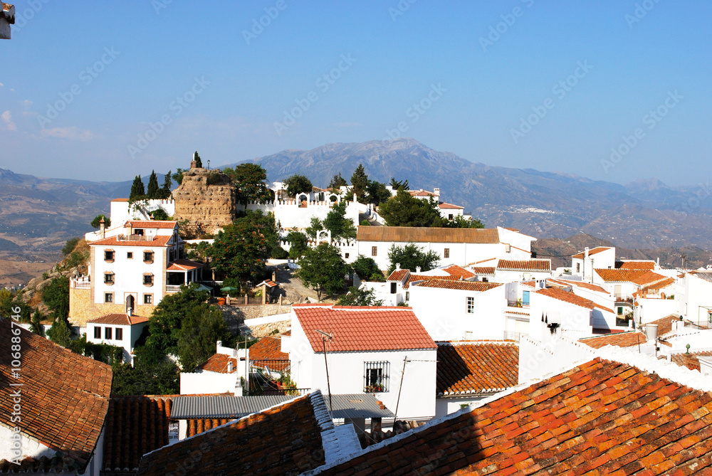 View of the town and castle with the mountains to the rear, Comares.