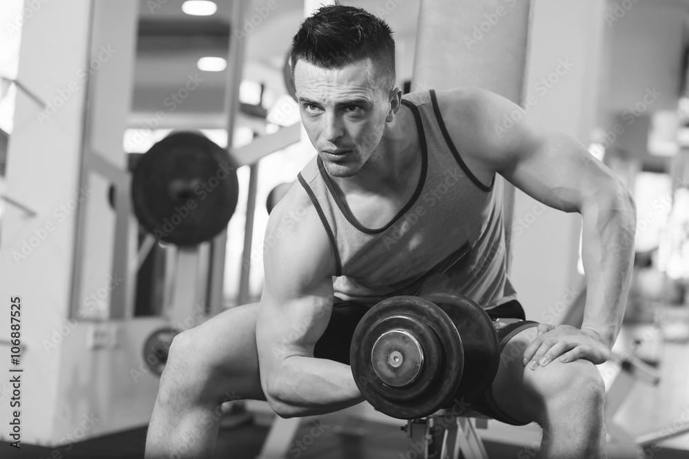 Fit Athlete Working Out Biceps - Dumbbell Concentration Curls