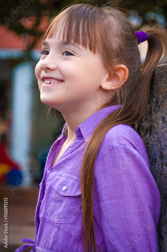 Happy child on the background of the street