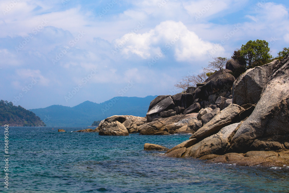 Coast rock cloudy blue sky clear water. LIPE Thailand