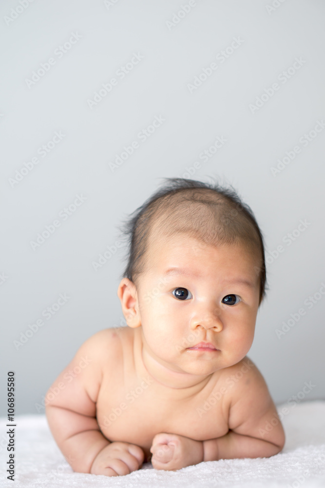 Asian baby lying on stomach Asian baby lying on stomach