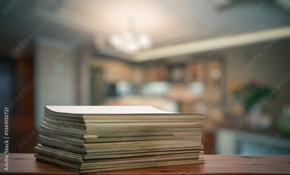 stack of old magazines on wooden table stack of old magazines on wooden table