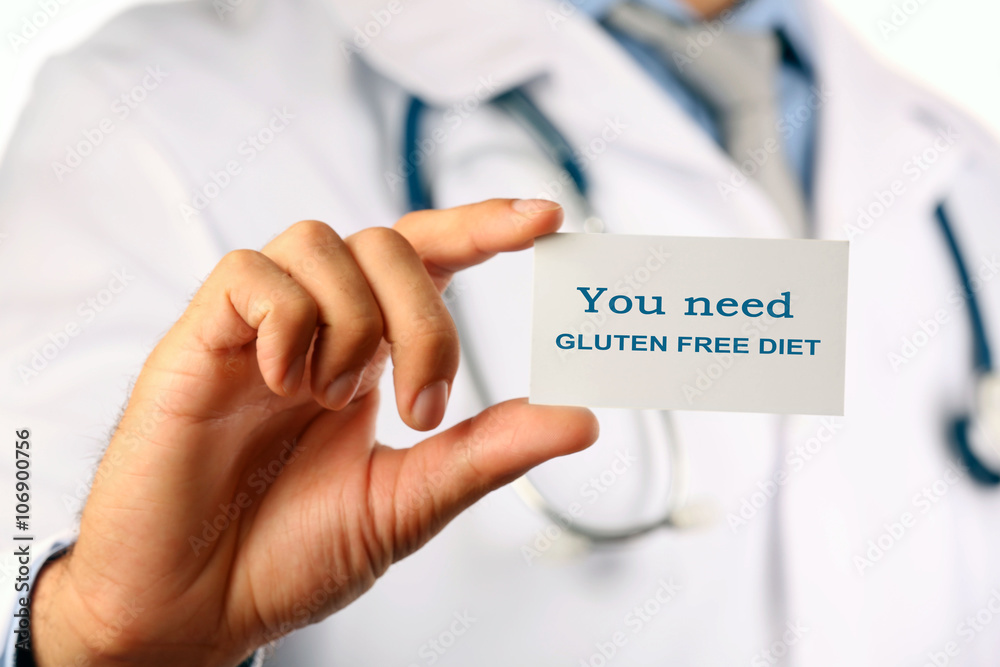Doctor with text You need gluten free diet on badge closeup Doctor with text You need gluten free diet on badge closeup