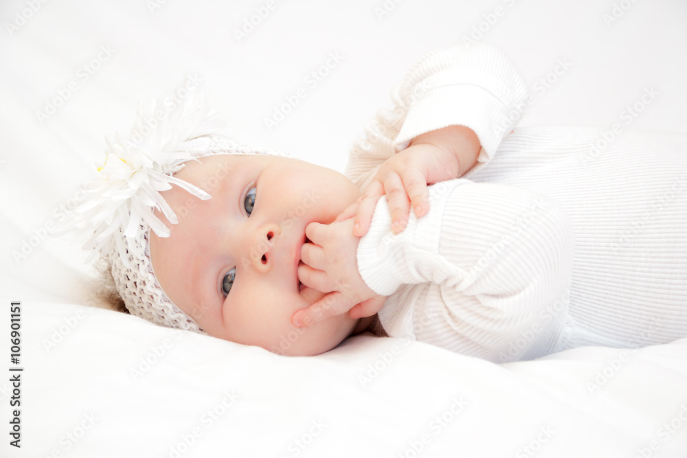 little newborn girl lying on the bed little newborn girl lying on the bed