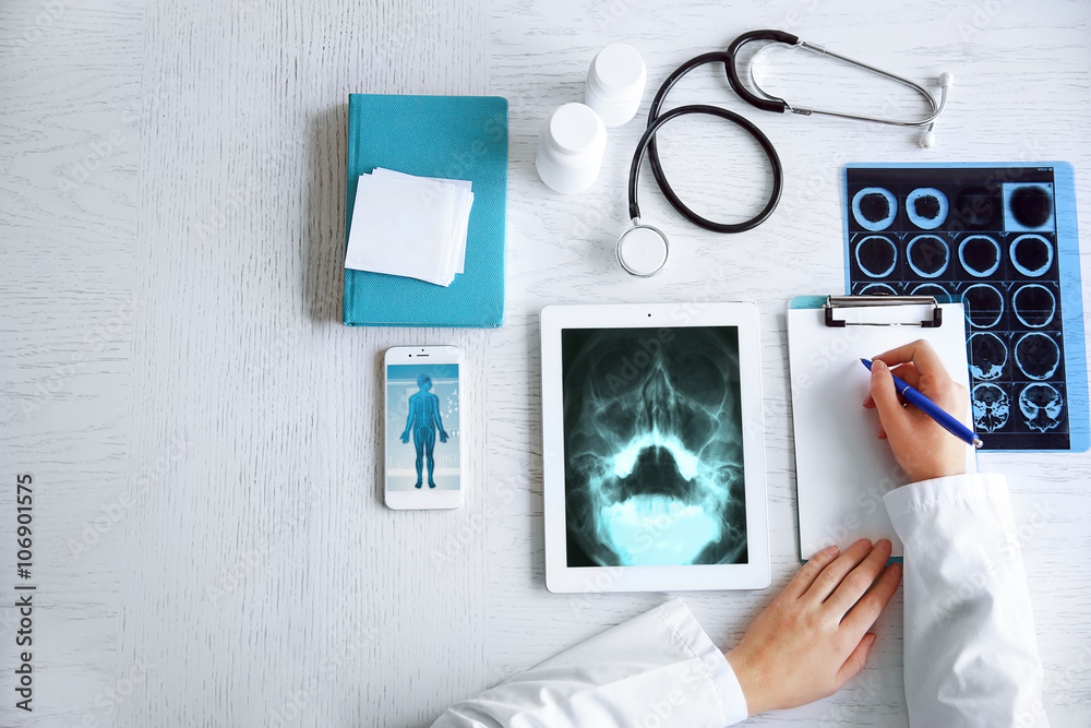 Doctor using his tablet-pc, close up Doctor using his tablet-pc, close up
