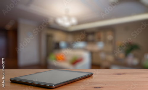 tablet on wooden table